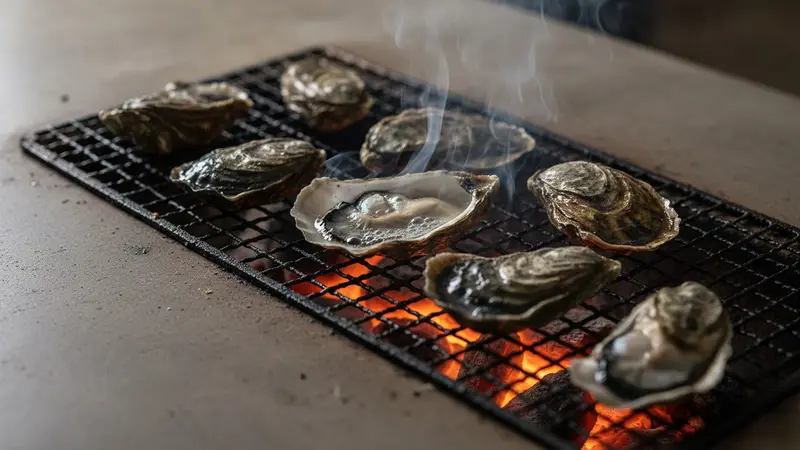 Grill oysters over direct heat until they pop
