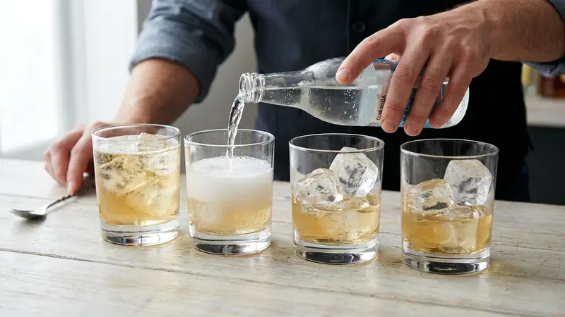 Top with soda and stir