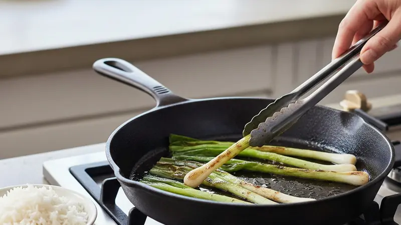 Char the scallions and finish the rice