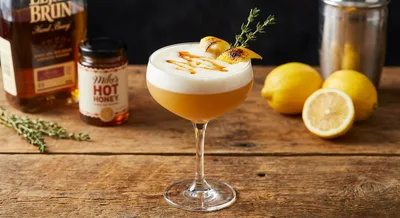 Mike's Hot Honey Whiskey Sour with Honey-Infused Syrup
